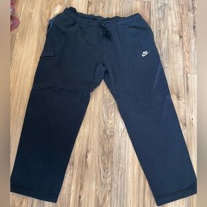 Nike blue sweatpants pockets on both sides and side pocket half way down one leg